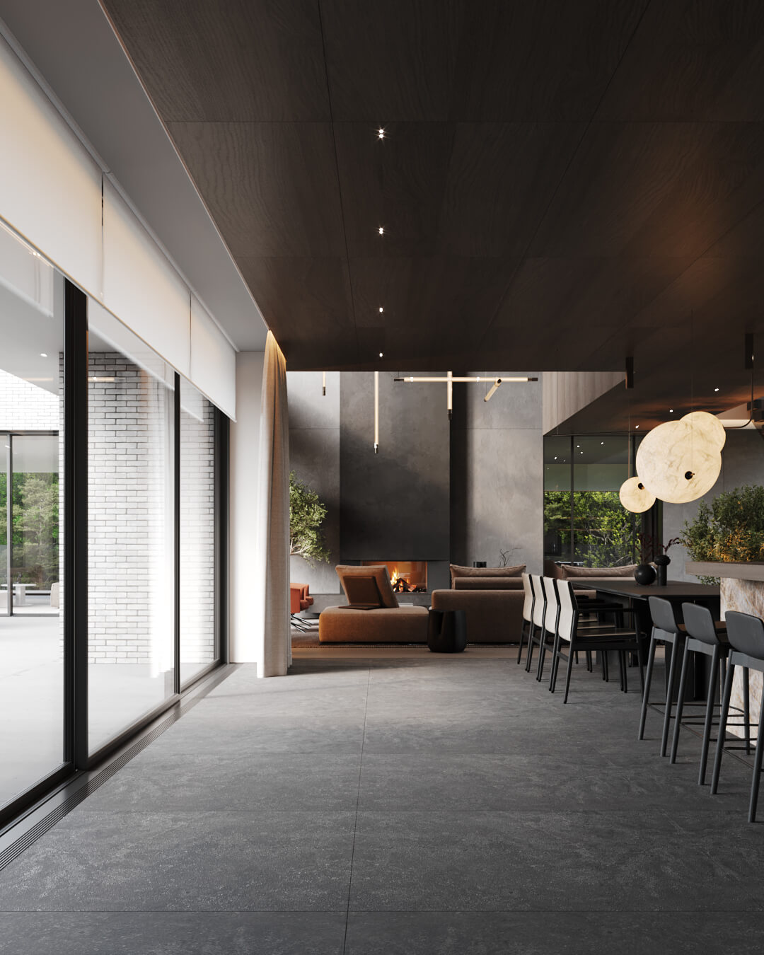 Wnętrze nowoczesnego domu z dużymi oknami, kominkiem i minimalistycznym wystrojem.