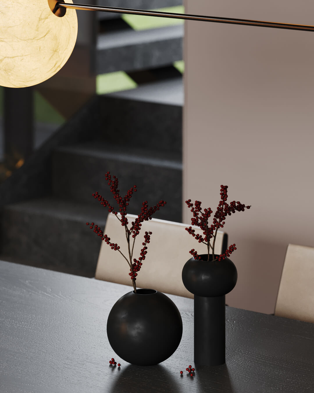 Dekoracyjne czarne wazony z gałązkami na stole, w tle schody.