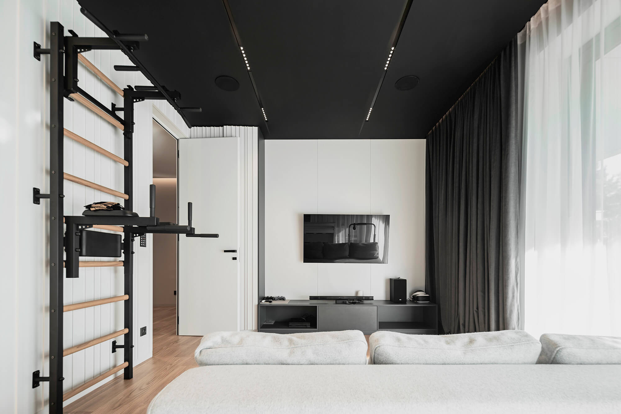 Sunlit living room with large windows, promoting Vitamin D and health.